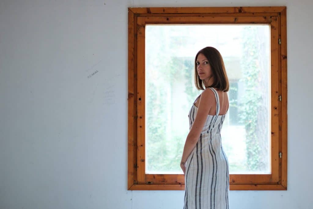 Understanding your self-image and identity 3 Woman standing in front of a window