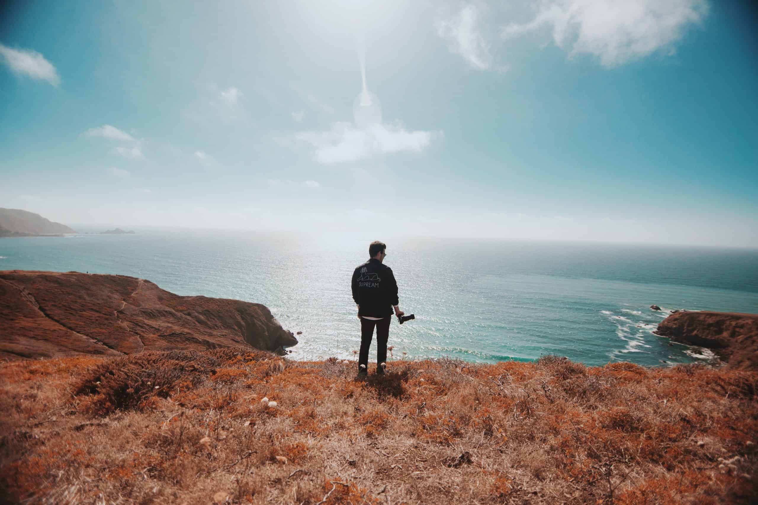 Man stood in clearing considering what to do when you don't know what to do