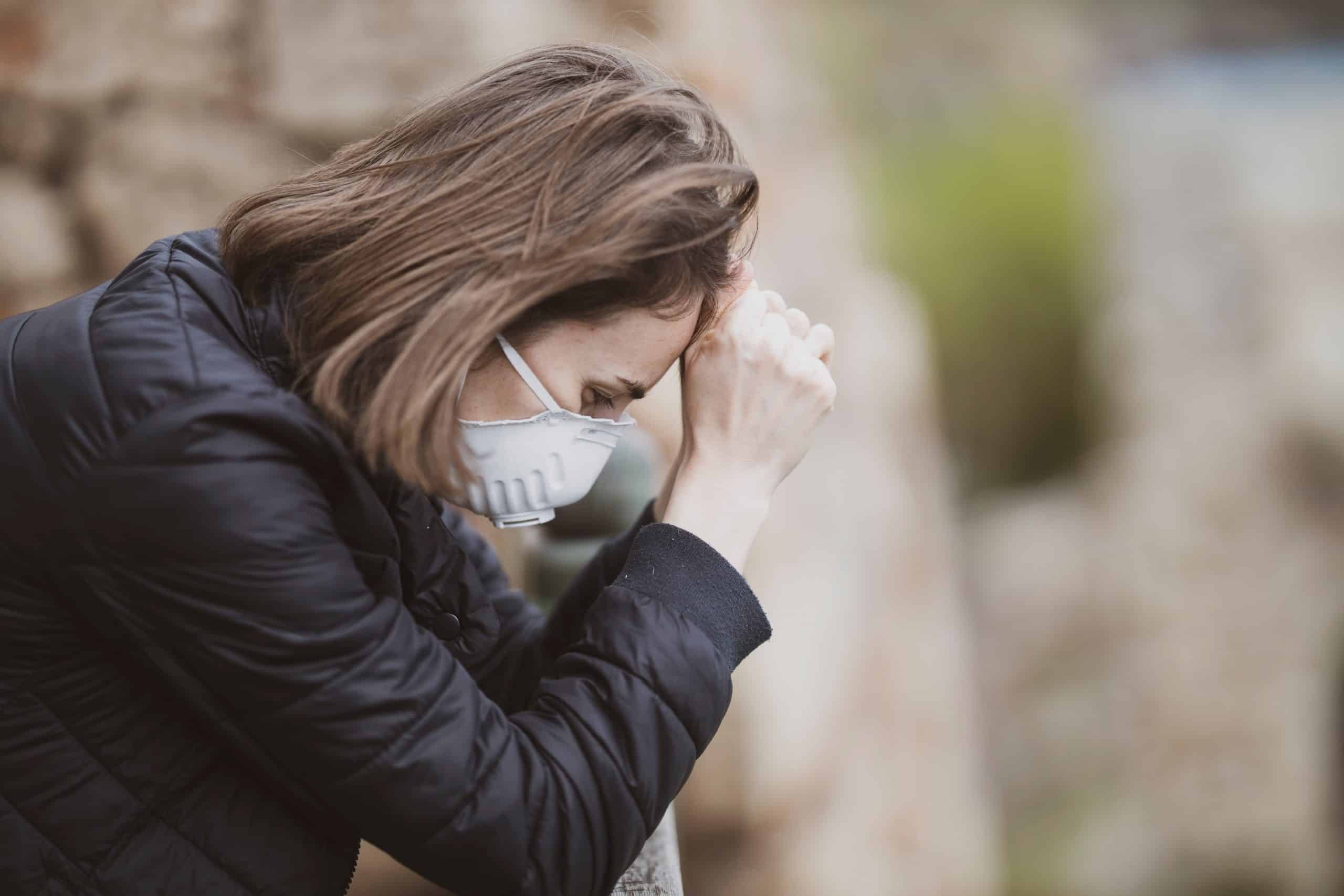 Help for those who feel like they don't fit in anywhere 10 Woman in mask with head in hands