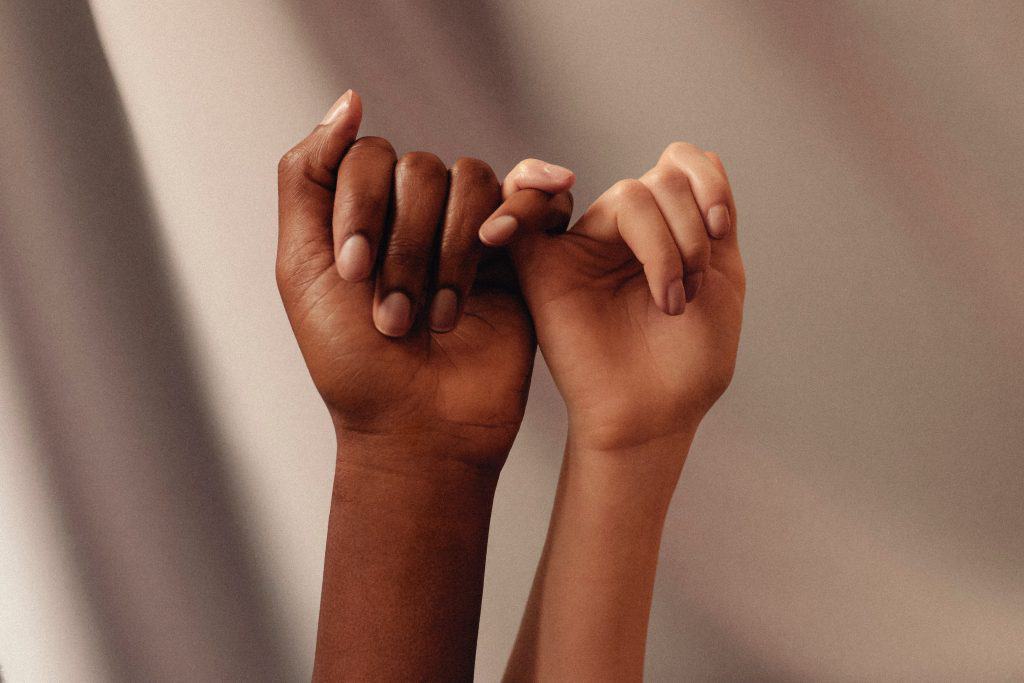 Ways to cope when people let you down 3 Two people linking their pinky fingers