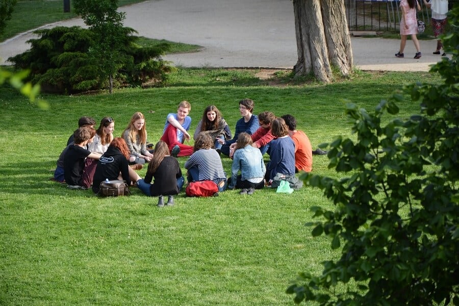 Effective communication - the key to a better life 3 Circle of friends sat on grass