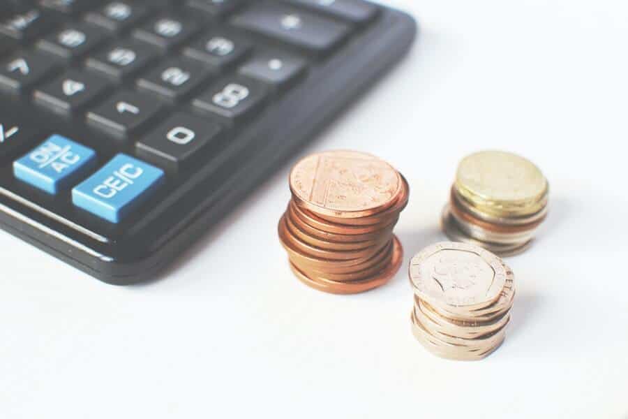 What Role Does Money Play In Your Life? 2 someone calculating the role of money in your life and if it makes you happier