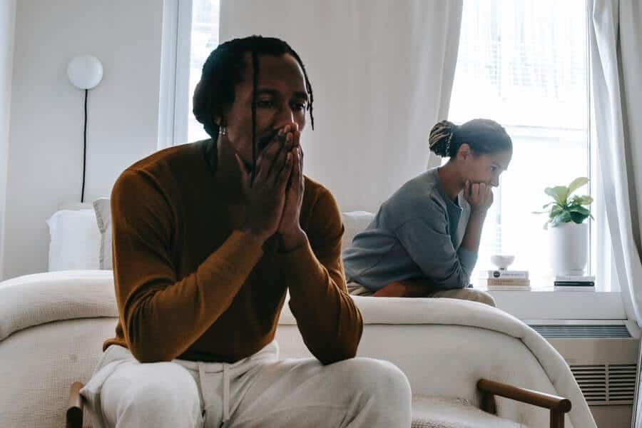 man and woman looking stressed