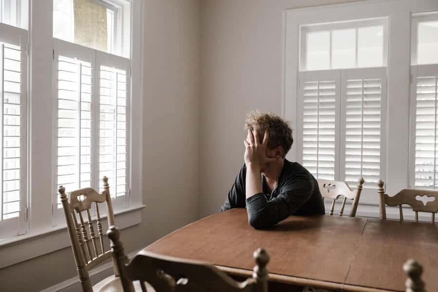 Is Money Addiction Real? How To Break Bad Spending Habits 8 man looking sad