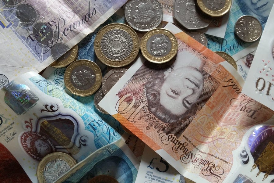Is Money Addiction Real? How To Break Bad Spending Habits 2 pound notes and coins