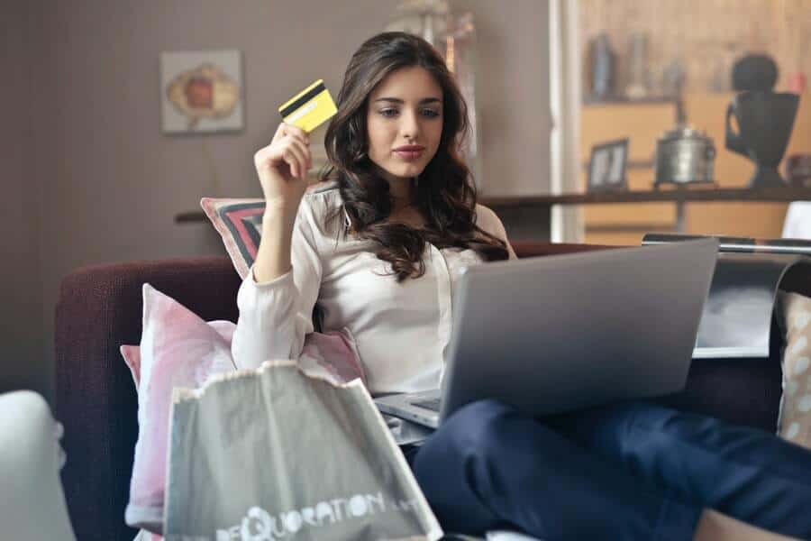 woman with a money addiction shopping online